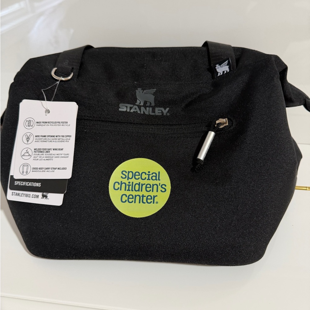 Stanley Black Cooler Bag with “special children’s center” logo